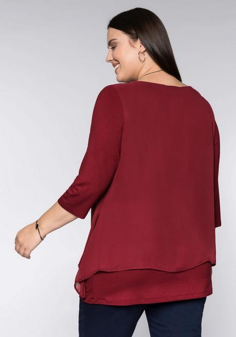sheego Blusenshirt in leichter A-Linie mit Zipfelsaum - rubinrot sheego Fabrikverkauf
